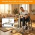 Person using a wheelchair with an adjustable base in a living room setting